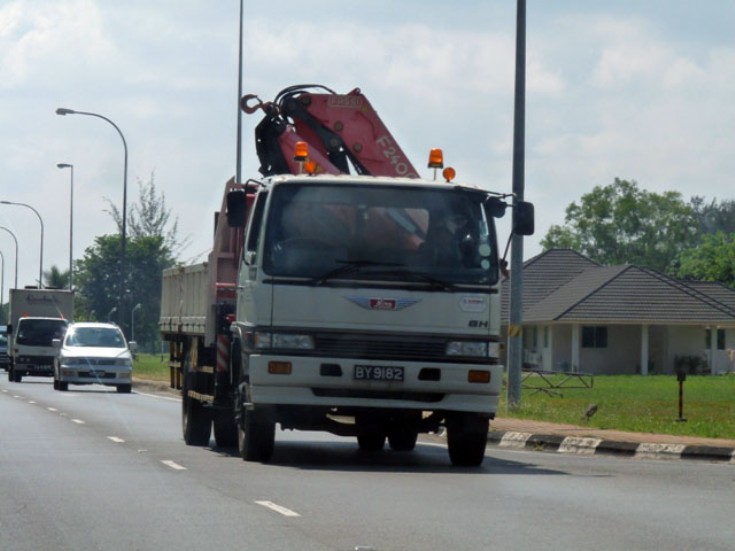 Hino SH Cargo truck with FASSI F2400 crane.