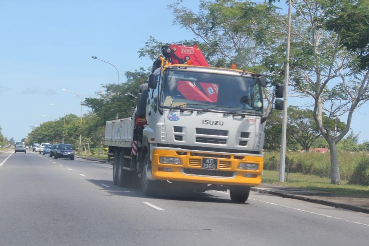 Latest Isuzu cargo truck with a FASSI mechanical crane, operated by Megalift Heavy Machinery