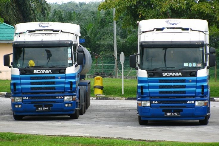 Pair of Scania 124L-420s with 4 axle tank trailers, at Tapah R&R, Malaysia