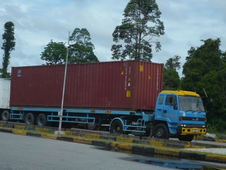 Isuzu tractor with container load 