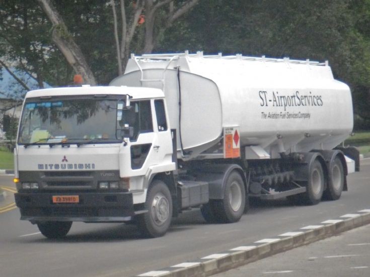 ST-Airport Services Turbo Engine Mitsubishi Fuso Great FP418 Tractor hauling a Trailer of Fuel Oil Tanker