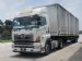 HINO 700 Tractor hauling a trailer with container