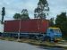 Isuzu tractor with container load 