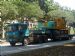 E-Lee Pte Ltd Mitsubishi Fuso Great FP411DR Tractor hauling a low loader trailer with a crawler crane