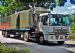 Hino Profia SH Tractor hauling a cargo trailer with timber side wall boards.