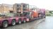 Huge lowloader with a fork truck